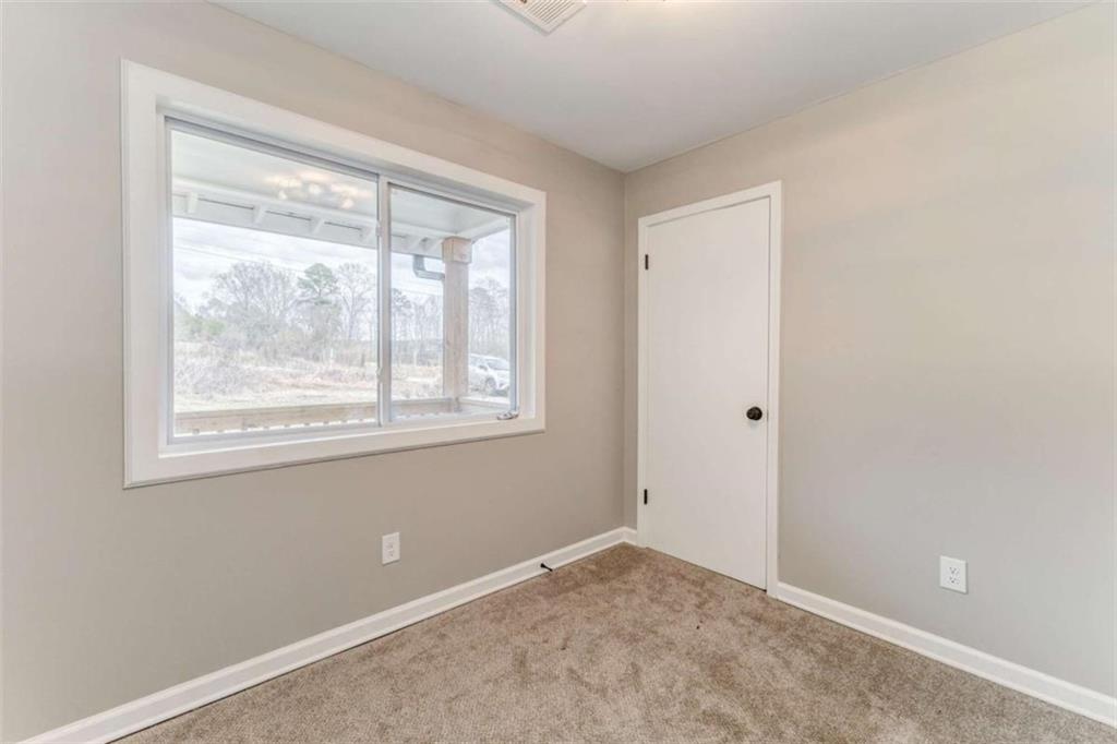 197 Colquitt Road Cedartown, GA 30125 - Photo 42 of 62 a view of an empty room with a window