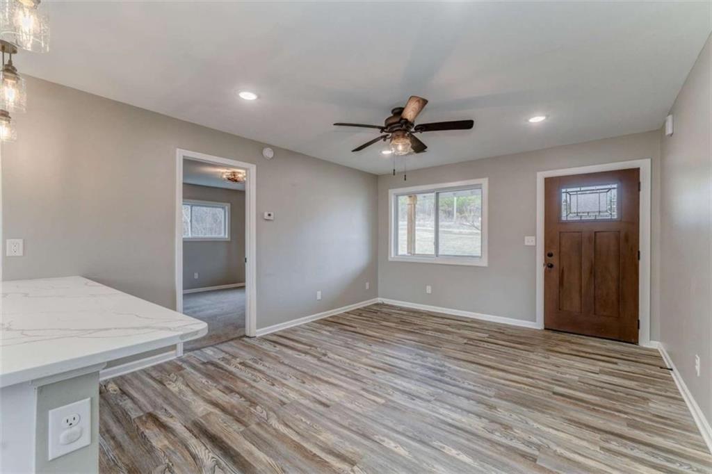 197 Colquitt Road Cedartown, GA 30125 - Photo 5 of 62 a view of empty room with wooden floor and fan