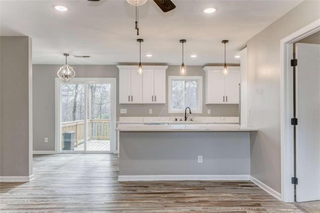 197 Colquitt Road Cedartown, GA 30125 - Photo 9 of 62 a large kitchen with kitchen island a sink stainless steel appliances and cabinets