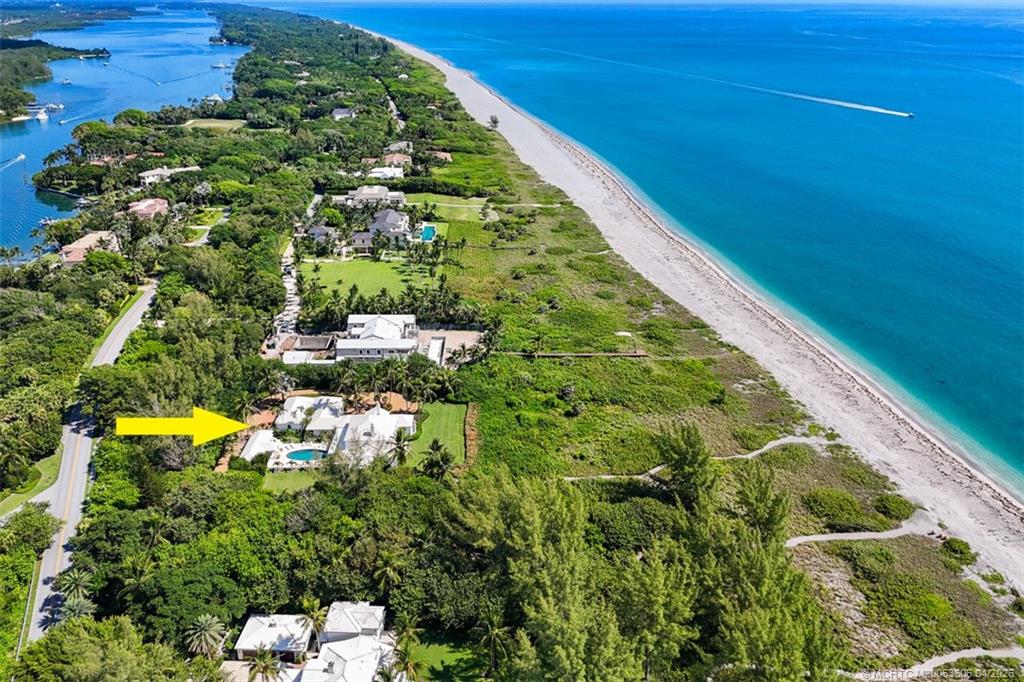 485 South Beach Road Hobe Sound, FL 33455 - Photo 2 of 12 a view of a garden with a swimming pool