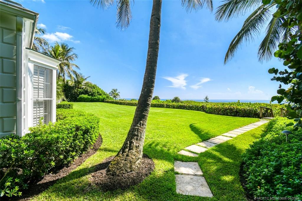 485 South Beach Road Hobe Sound, FL 33455 - Photo 10 of 12 a view of a garden with an outdoor space