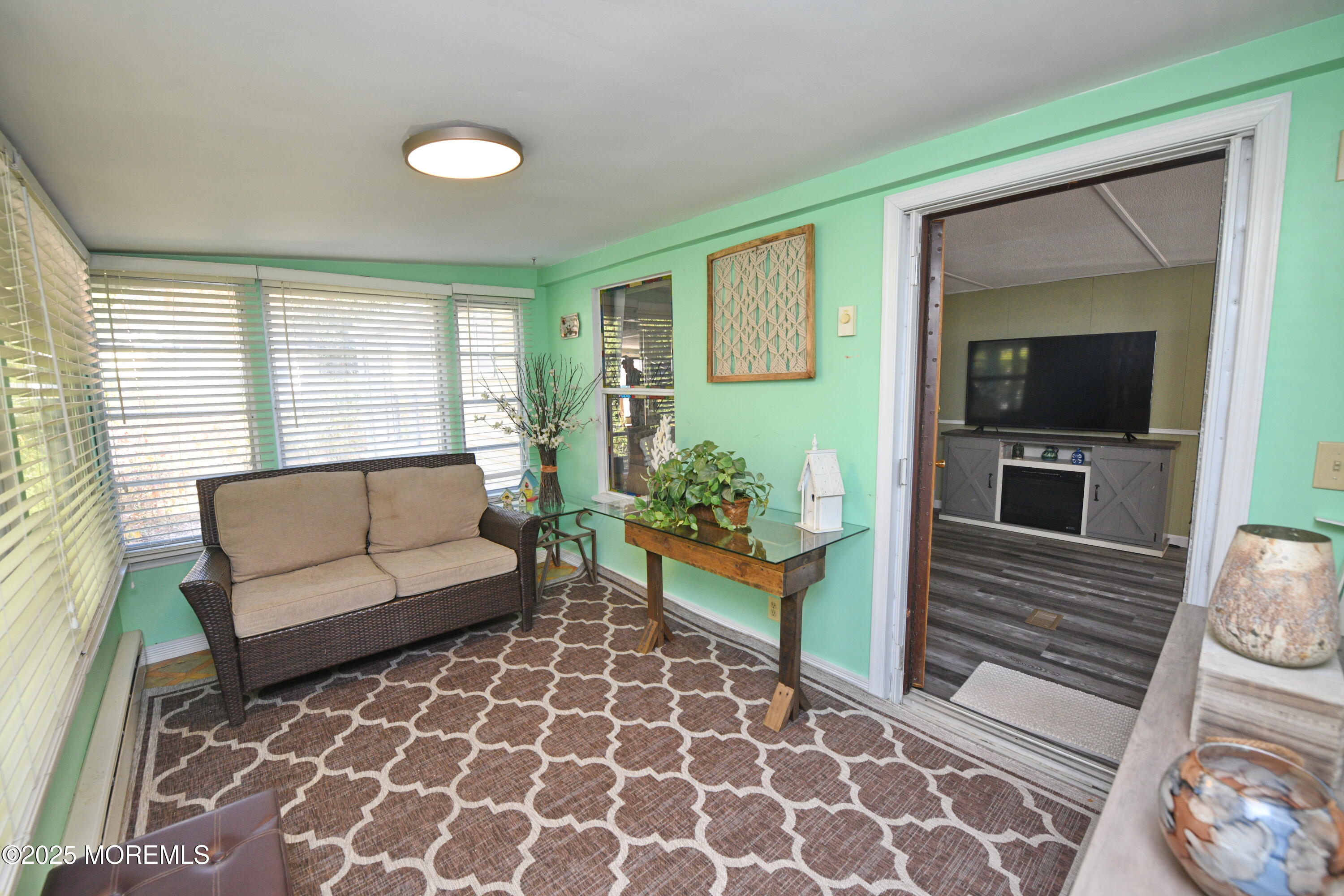 35 Judith Way Jackson, NJ 08527 - Photo 12 of 20 a living room with furniture and a flat screen tv