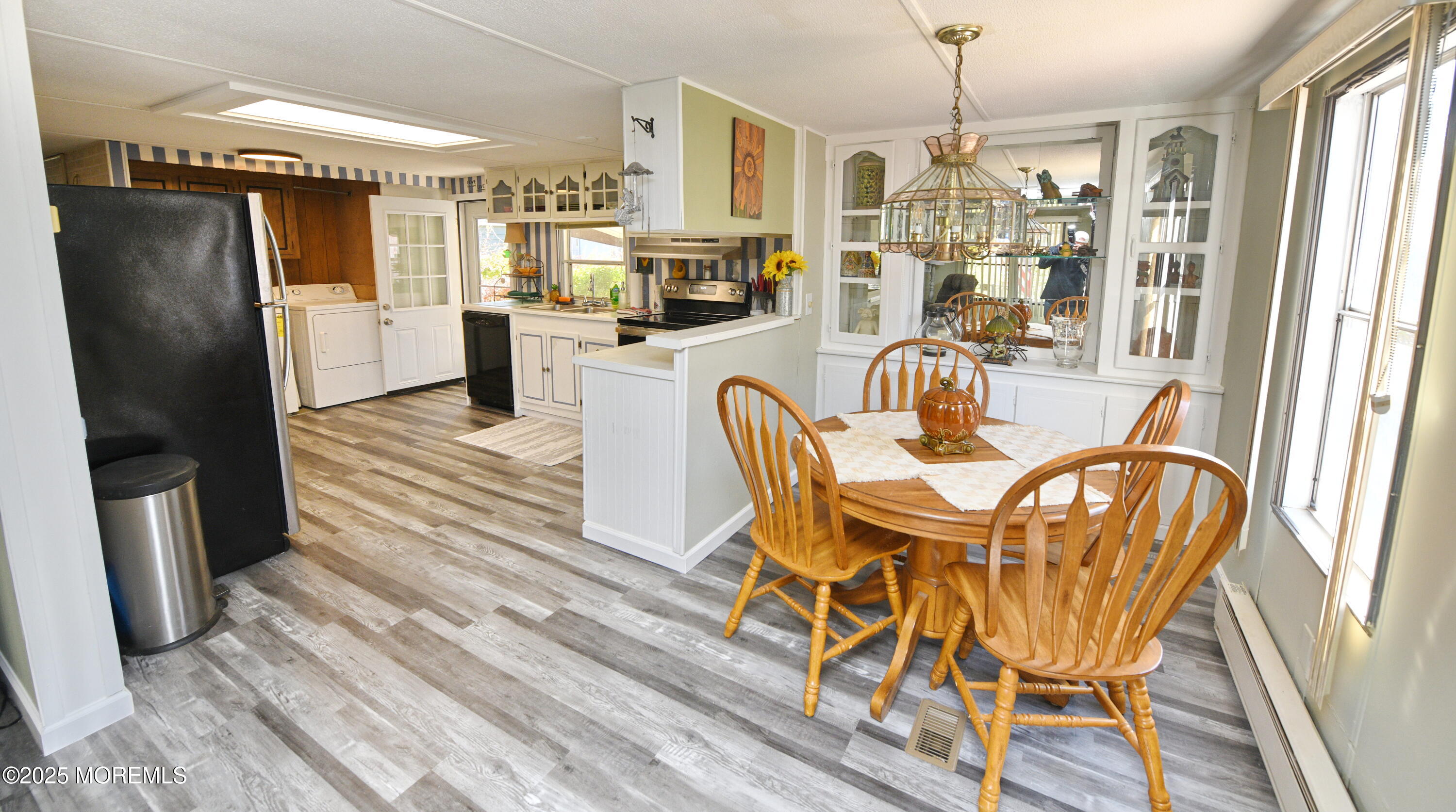 35 Judith Way Jackson, NJ 08527 - Photo 4 of 20 a dining room with furniture a chandelier and wooden floor
