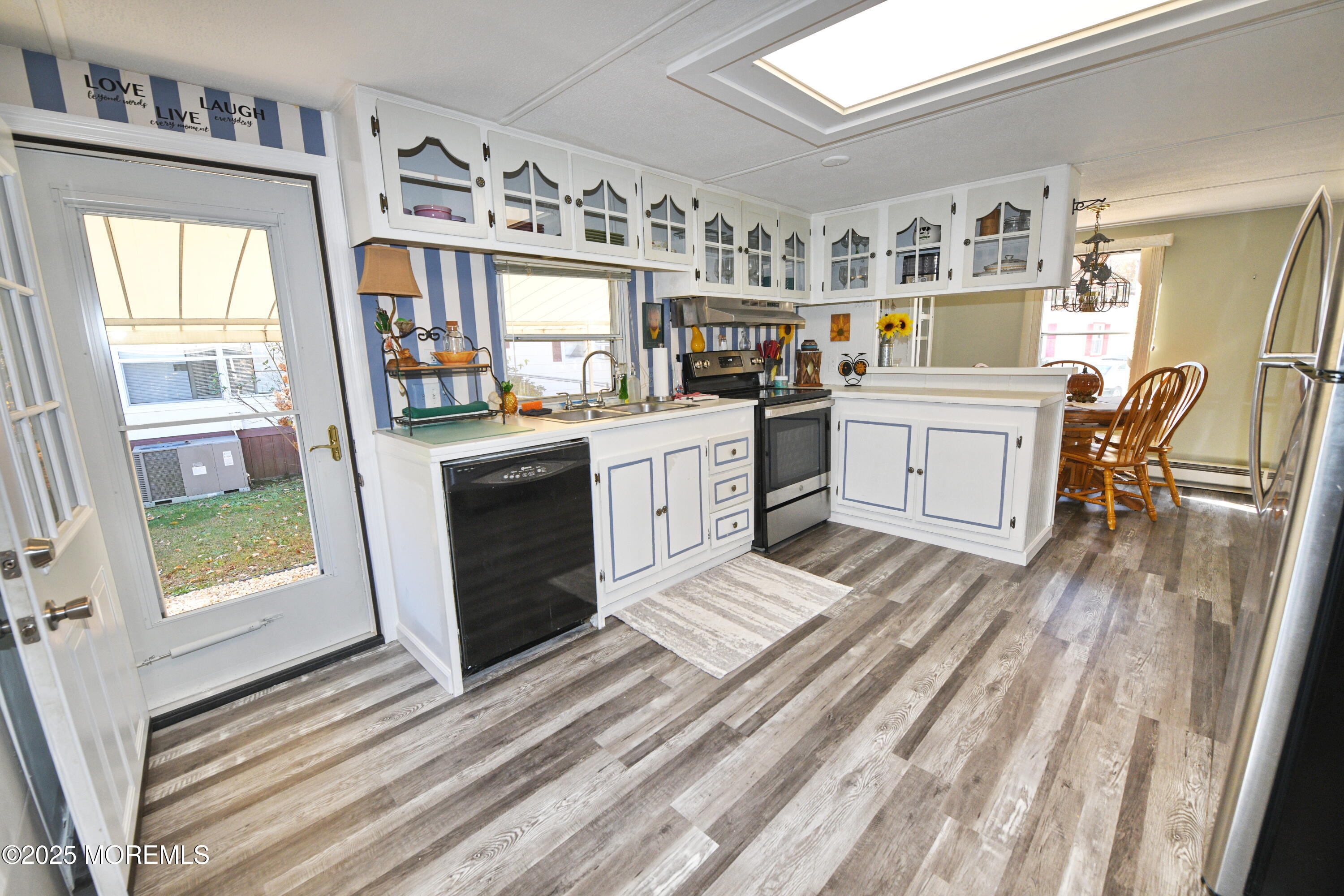 35 Judith Way Jackson, NJ 08527 - Photo 5 of 20 a kitchen with stainless steel appliances a stove a sink and a refrigerator