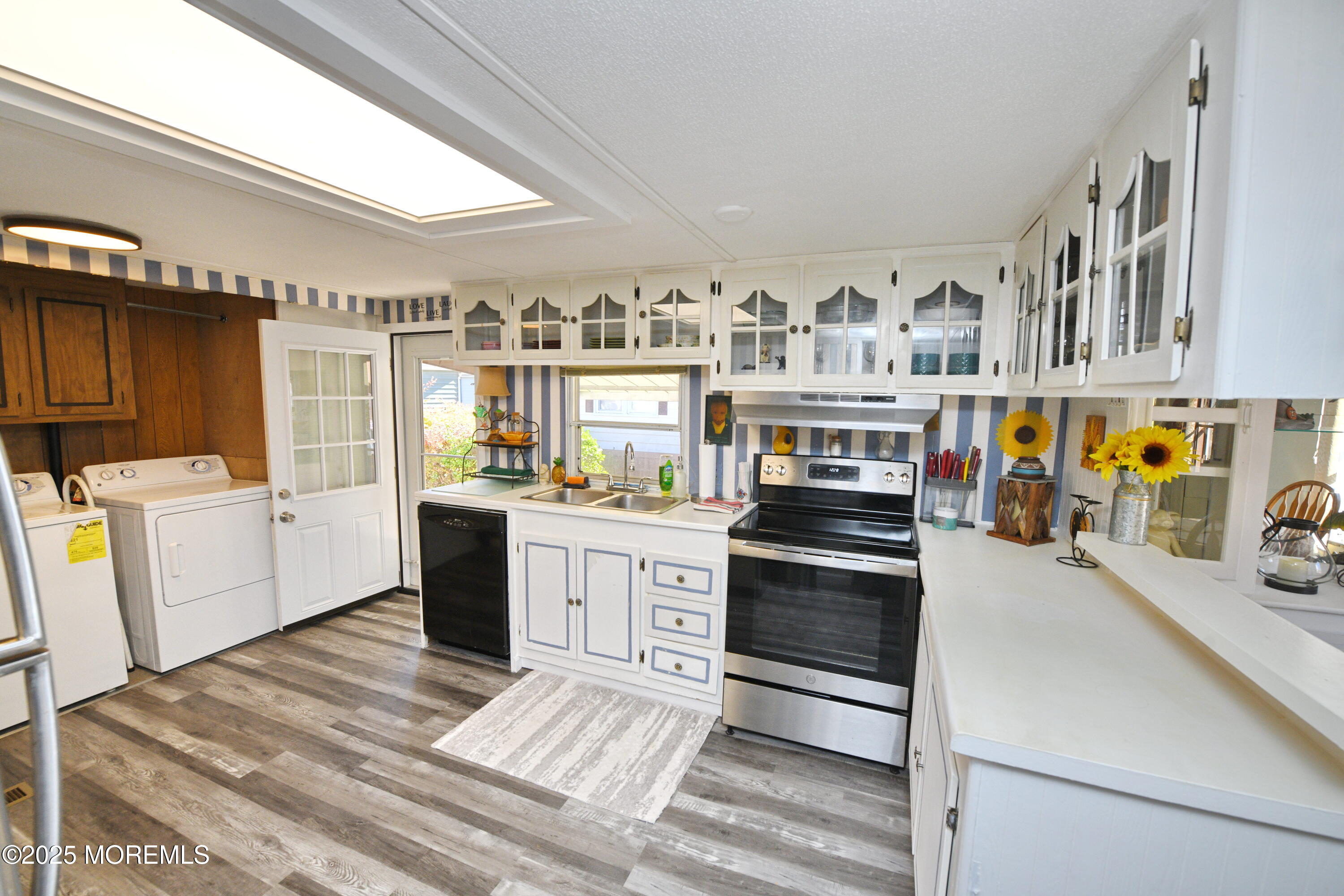 35 Judith Way Jackson, NJ 08527 - Photo 7 of 20 a kitchen with stainless steel appliances and white cabinets