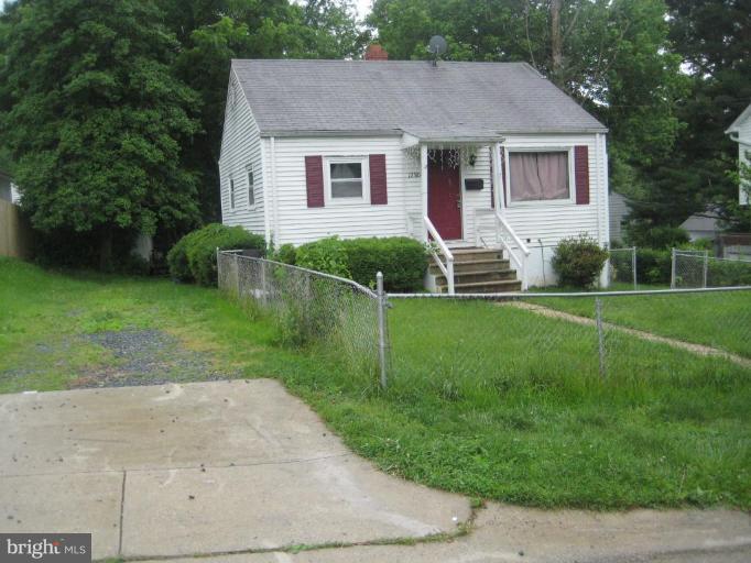 12310 Charles Road Silver Spring, MD 20906 - Photo 2 of 14 a front view of house with yard and green space