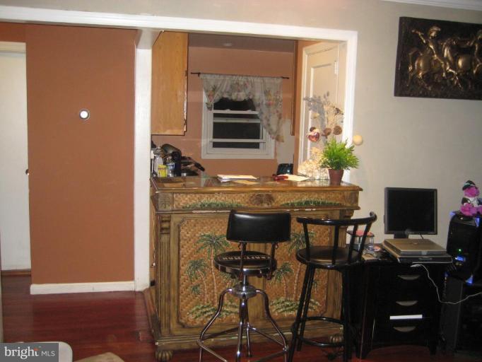 12310 Charles Road Silver Spring, MD 20906 - Photo 4 of 14 a kitchen with a table and chairs in it