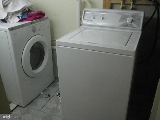 12310 Charles Road Silver Spring, MD 20906 - Photo 7 of 14 a utility room with dryer and washer