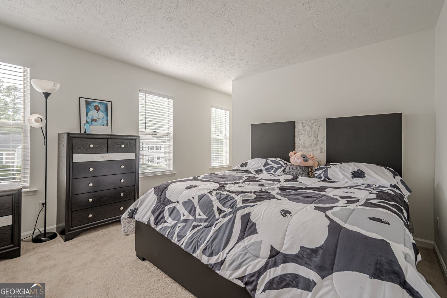 3403 Spring Harbor Lane Doraville, GA 30340 - Photo 12 of 27 a bed sitting in a bedroom and dresser