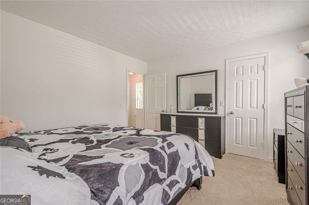 3403 Spring Harbor Lane Doraville, GA 30340 - Photo 14 of 27 a bedroom with a bed and a television