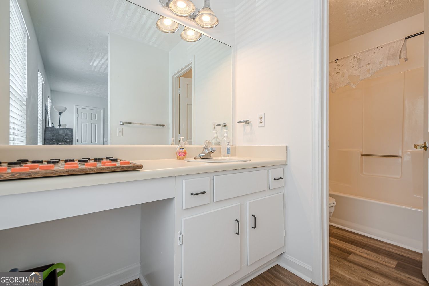 3403 Spring Harbor Lane Doraville, GA 30340 - Photo 15 of 27 a bathroom with a sink vanity and mirror