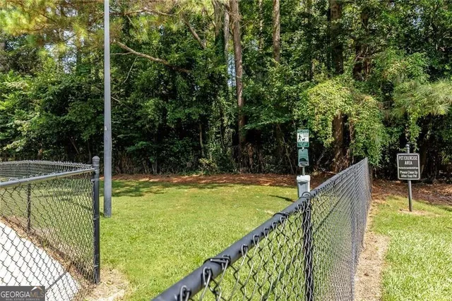 a view of a balcony with yard