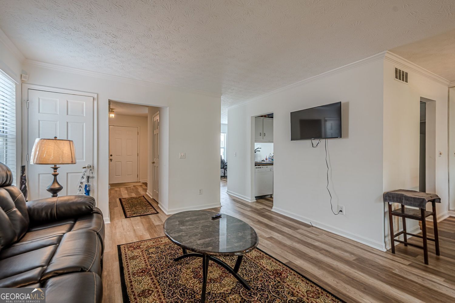 3403 Spring Harbor Lane Doraville, GA 30340 - Photo 7 of 27 a living room with furniture and a flat screen tv
