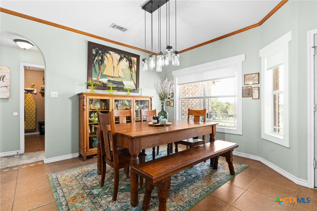 690 A County Road 4707 Kempner, TX 76539 - Photo 8 of 39 a view of a dining room with furniture window and wooden floor