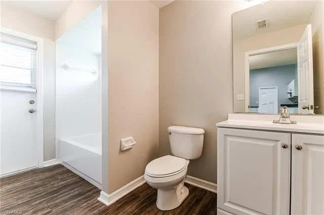 a bathroom with a toilet a sink and a bathtub