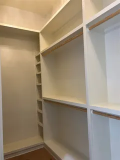 a bathroom with a bathtub shower sink vanity and toilet