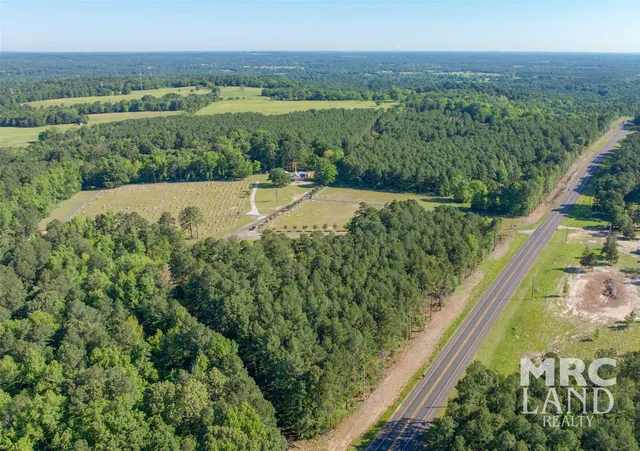 a view of a yard with a lake view