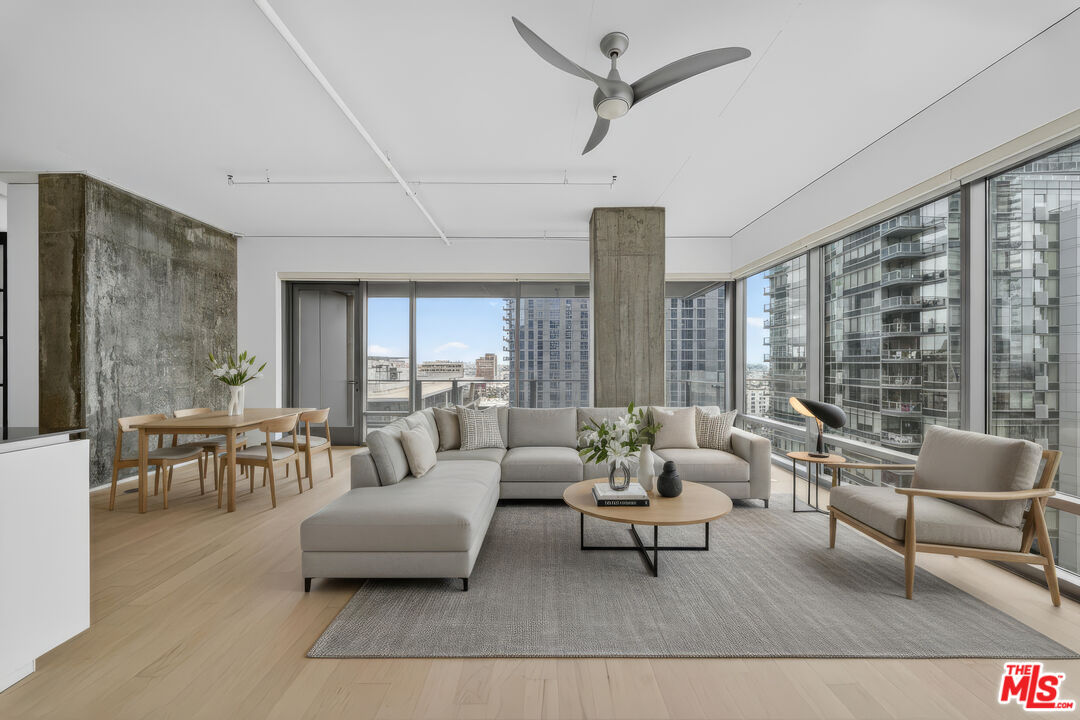 1100 South Hope Street, Unit 1501 Los Angeles, CA 90015 - Photo 2 of 63 a living room with furniture and a large window