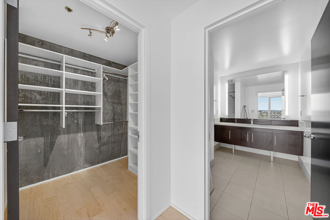 1100 South Hope Street, Unit 1501 Los Angeles, CA 90015 - Photo 22 of 63 a view of a walk in closet and living room