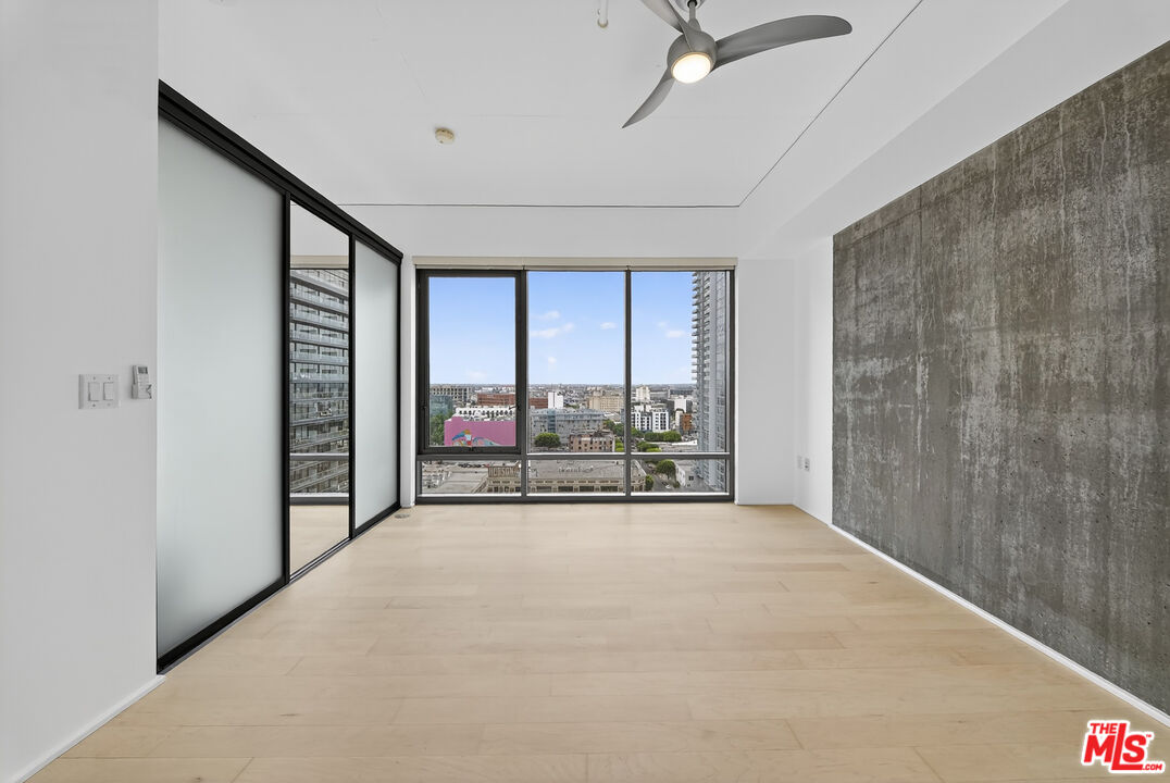 1100 South Hope Street, Unit 1501 Los Angeles, CA 90015 - Photo 27 of 63 a view of an empty room with a balcony