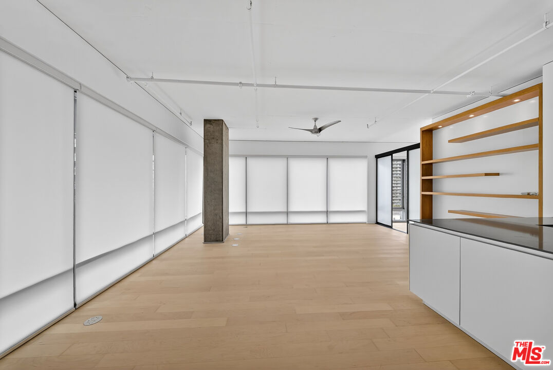 1100 South Hope Street, Unit 1501 Los Angeles, CA 90015 - Photo 34 of 63 a view of an empty room with a window