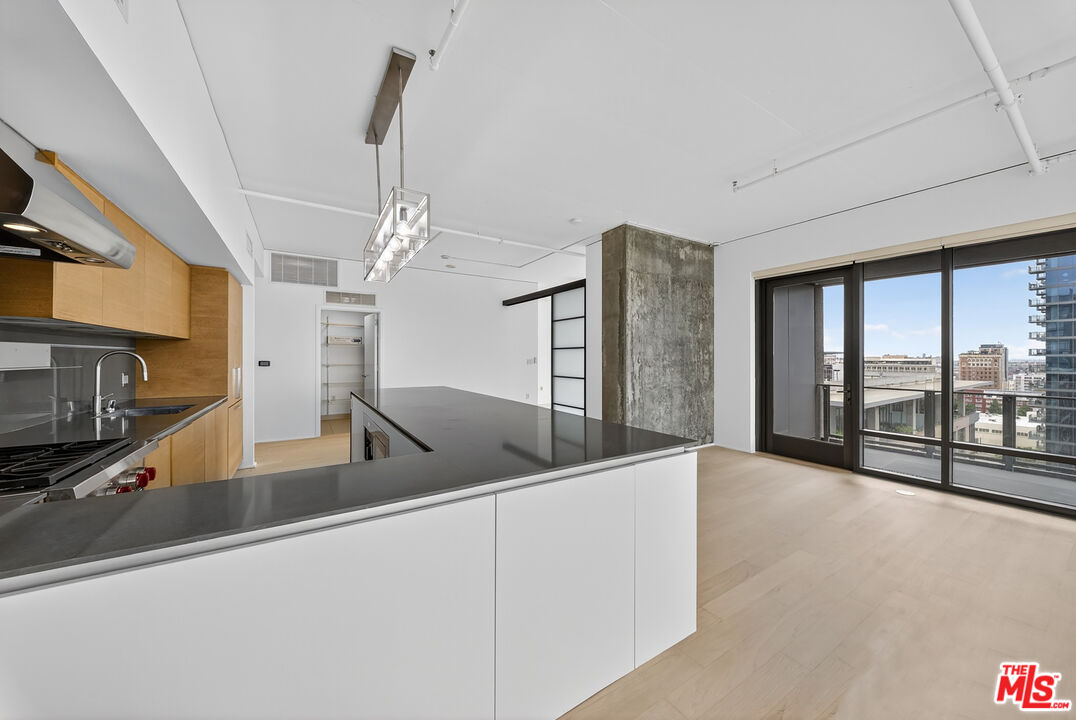 1100 South Hope Street, Unit 1501 Los Angeles, CA 90015 - Photo 38 of 63 a view of a kitchen with furniture and staircase