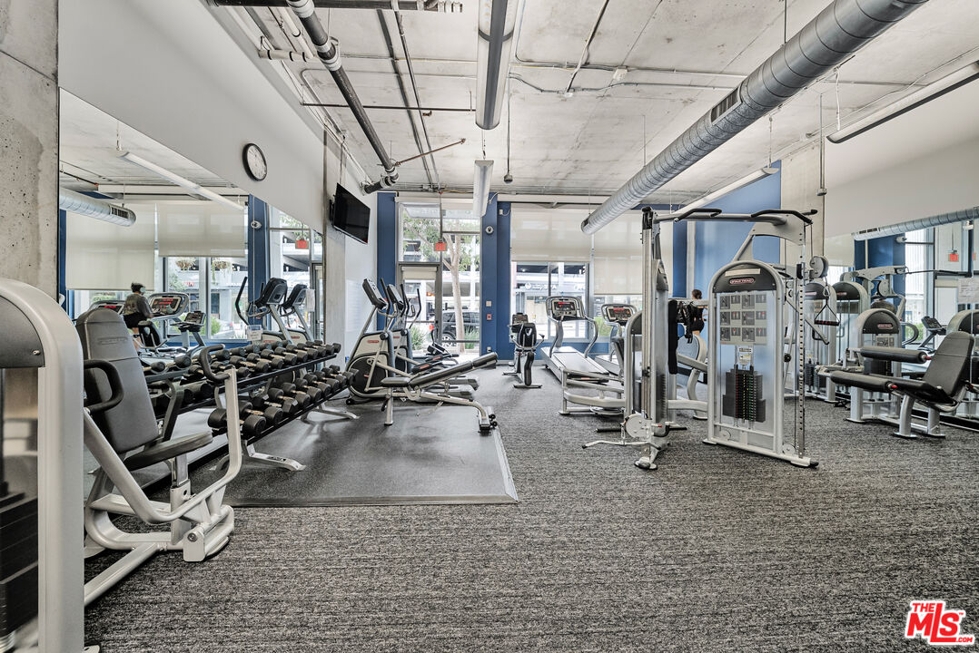 1100 South Hope Street, Unit 1501 Los Angeles, CA 90015 - Photo 55 of 63 a view of a room with gym equipment