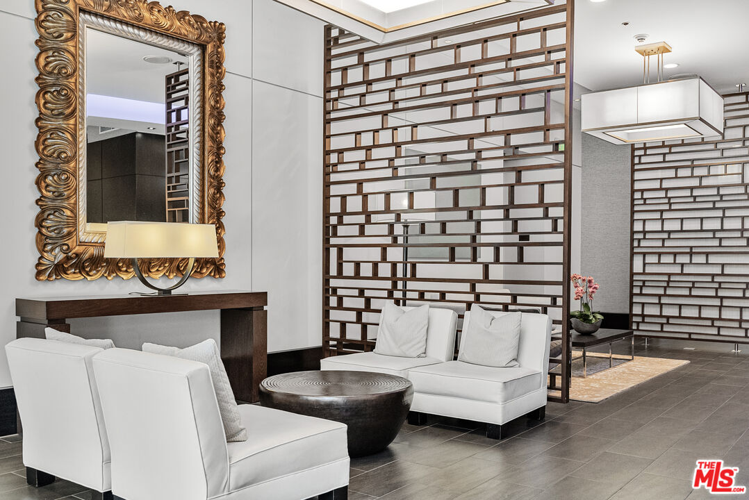 1100 South Hope Street, Unit 1501 Los Angeles, CA 90015 - Photo 62 of 63 a living room with furniture and a fireplace