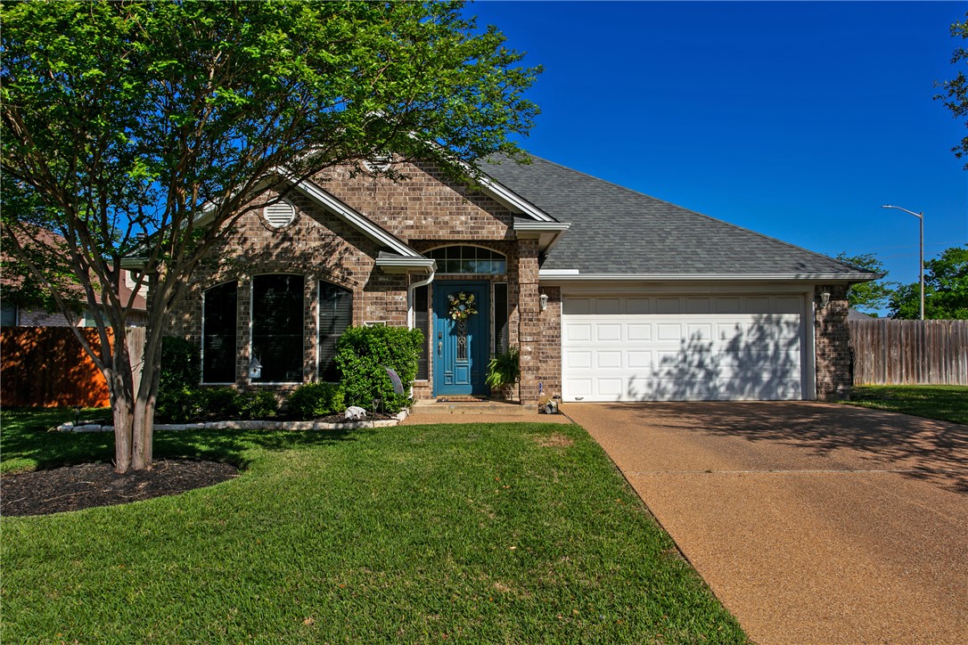 a front view of a house with a yard and porch