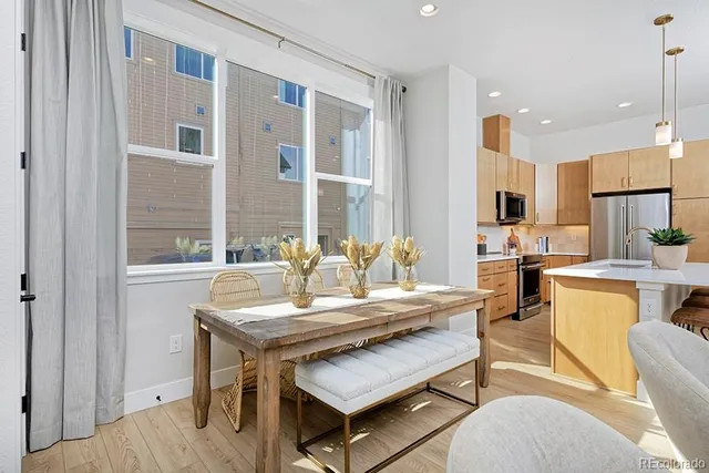a dining room with furniture and window
