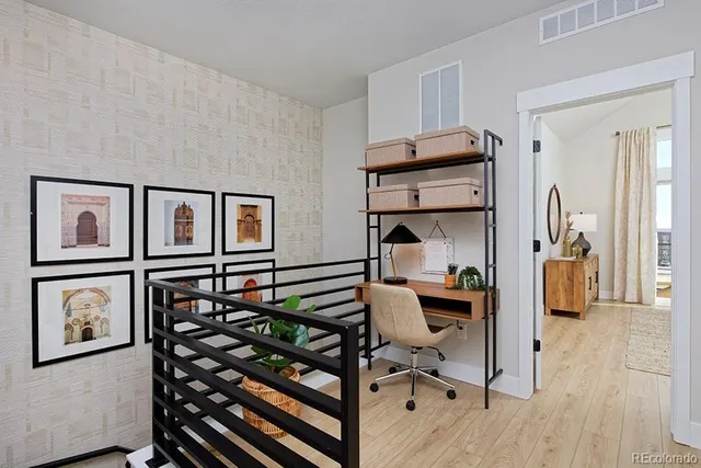 a view of a workspace with furniture