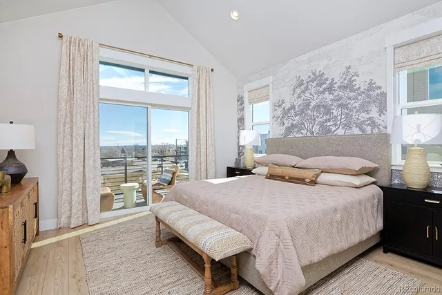 a bedroom with a bed and a night stand