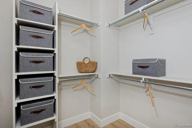 a view of an empty room with racks on the wall