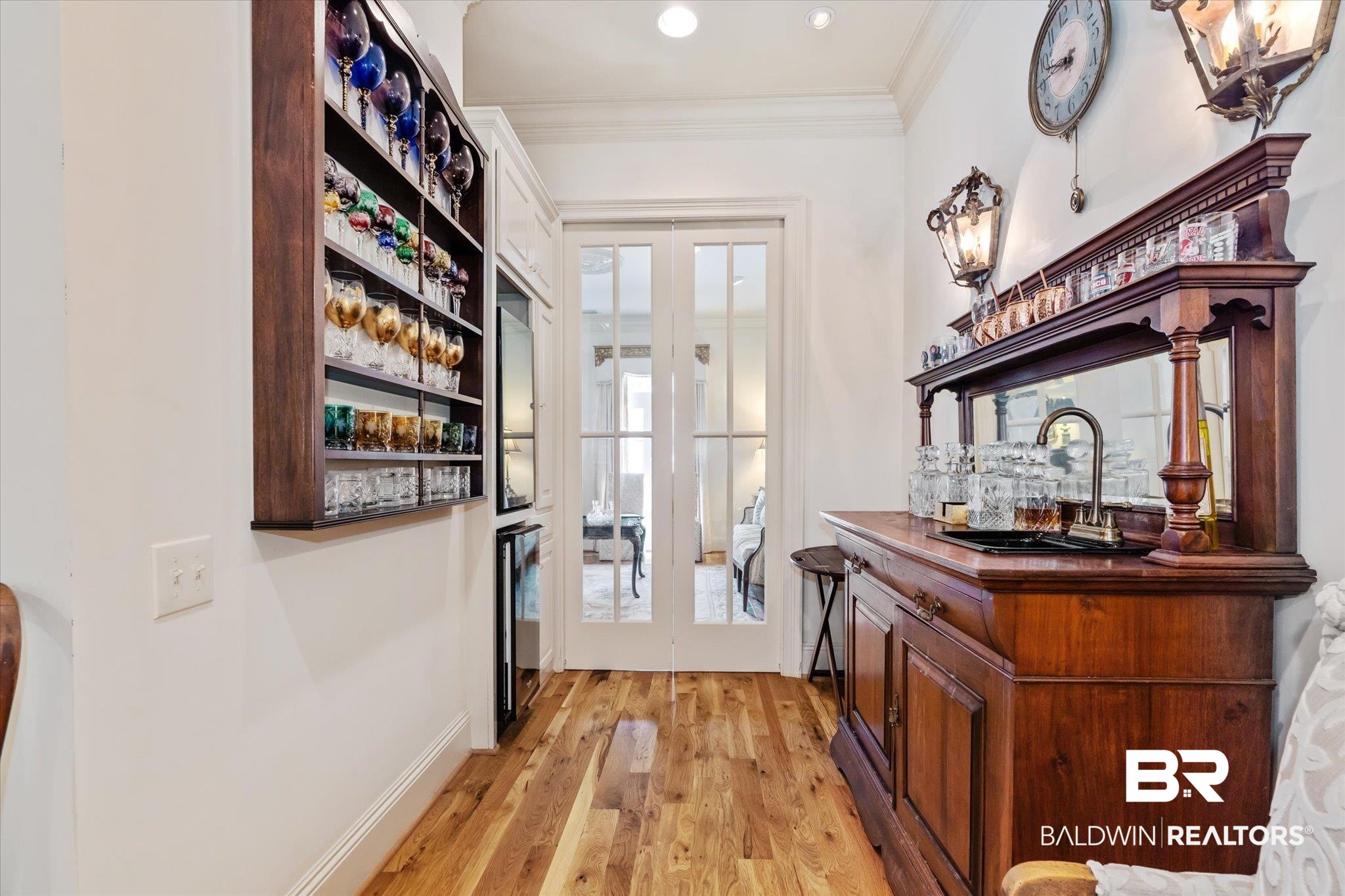 3963 Wimbledon Park Mobile, AL 36608 - Photo 18 of 51 Bar with sink, light wood-type flooring, french doors, a healthy amount of sunlight, and crown molding