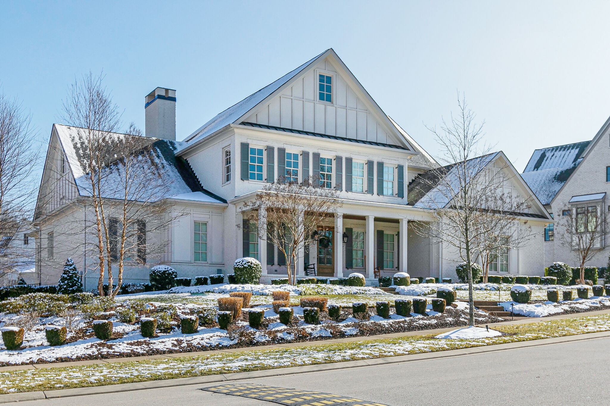8448 Heirloom Boulevard College Grove, TN 37046 - Photo 3 of 41 a front view of a house with lots of windows and plants
