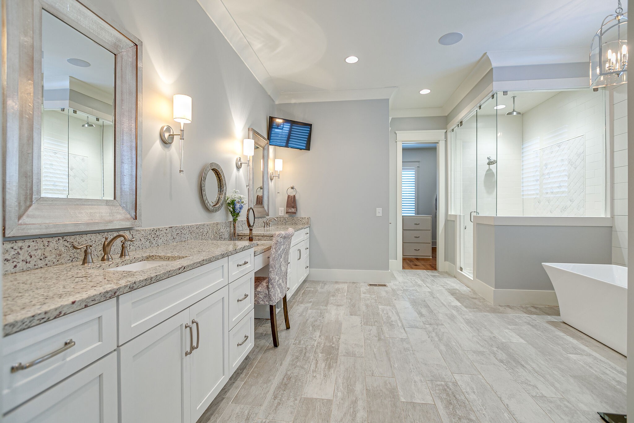 8448 Heirloom Boulevard College Grove, TN 37046 - Photo 22 of 41 a spacious bathroom with a granite countertop sink a mirror and a