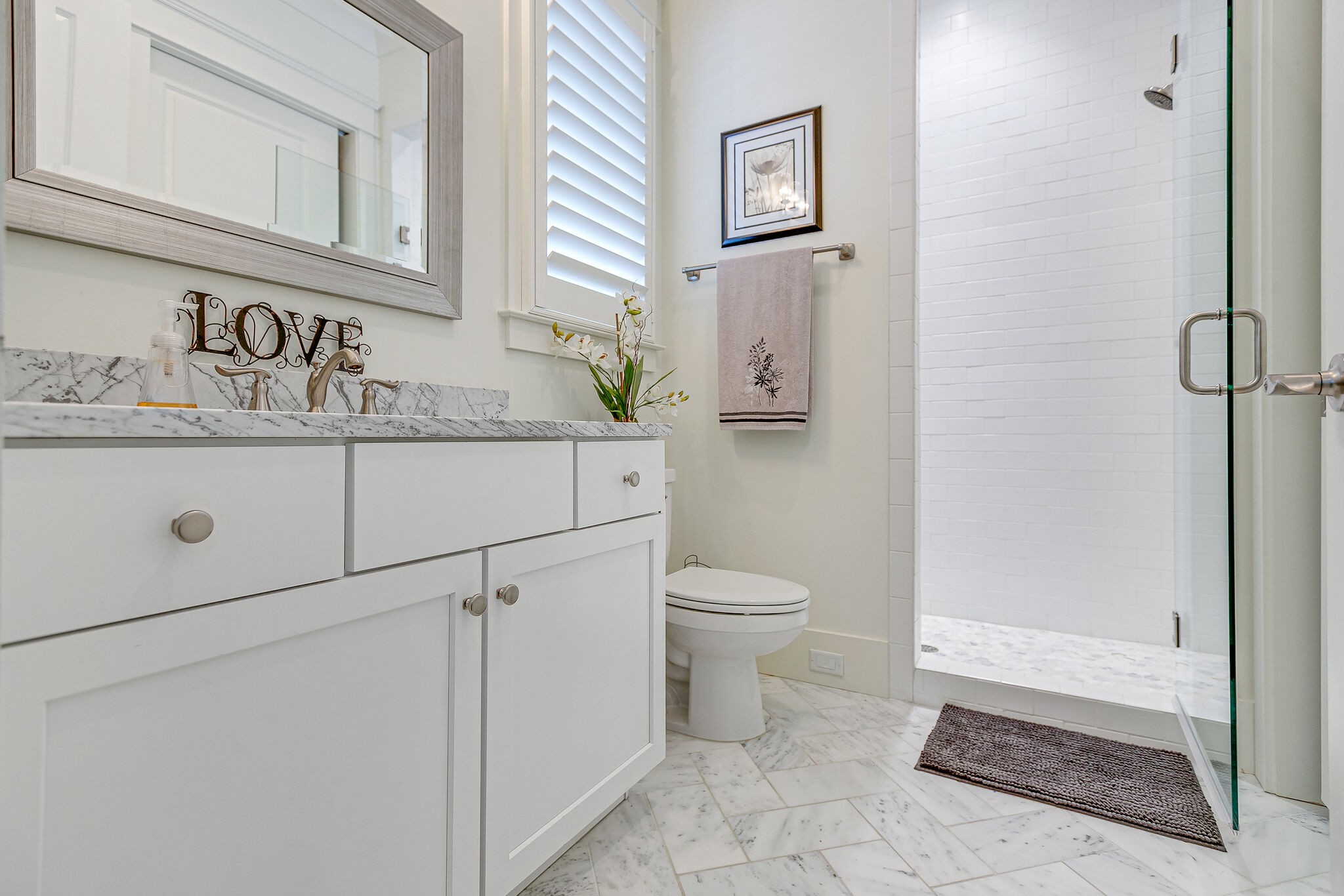 8448 Heirloom Boulevard College Grove, TN 37046 - Photo 27 of 41 a bathroom with a granite countertop sink a toilet and a mirror