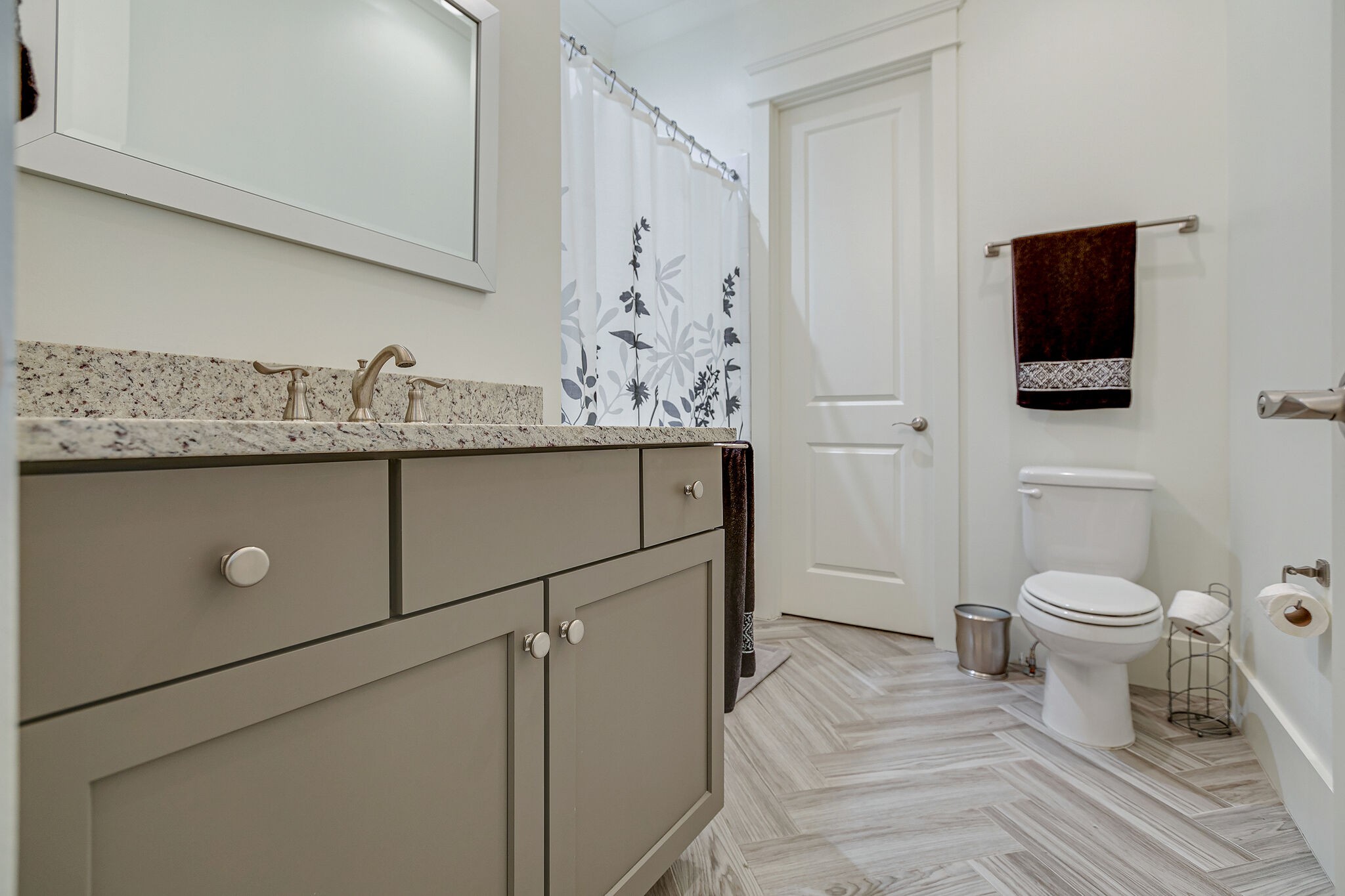 8448 Heirloom Boulevard College Grove, TN 37046 - Photo 31 of 41 a bathroom with a toilet a sink and mirror