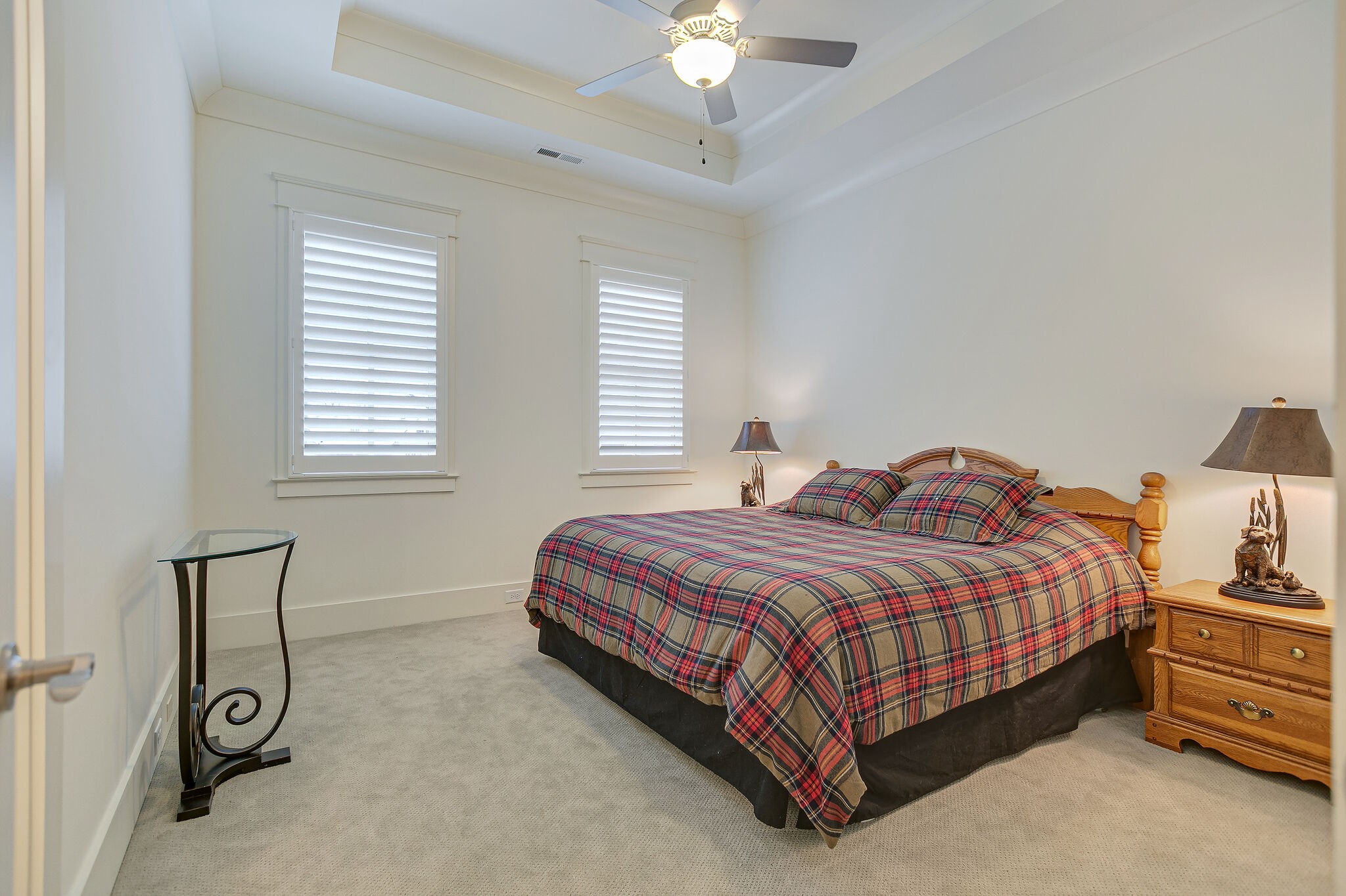 8448 Heirloom Boulevard College Grove, TN 37046 - Photo 33 of 41 a bedroom with a bed and a chandelier
