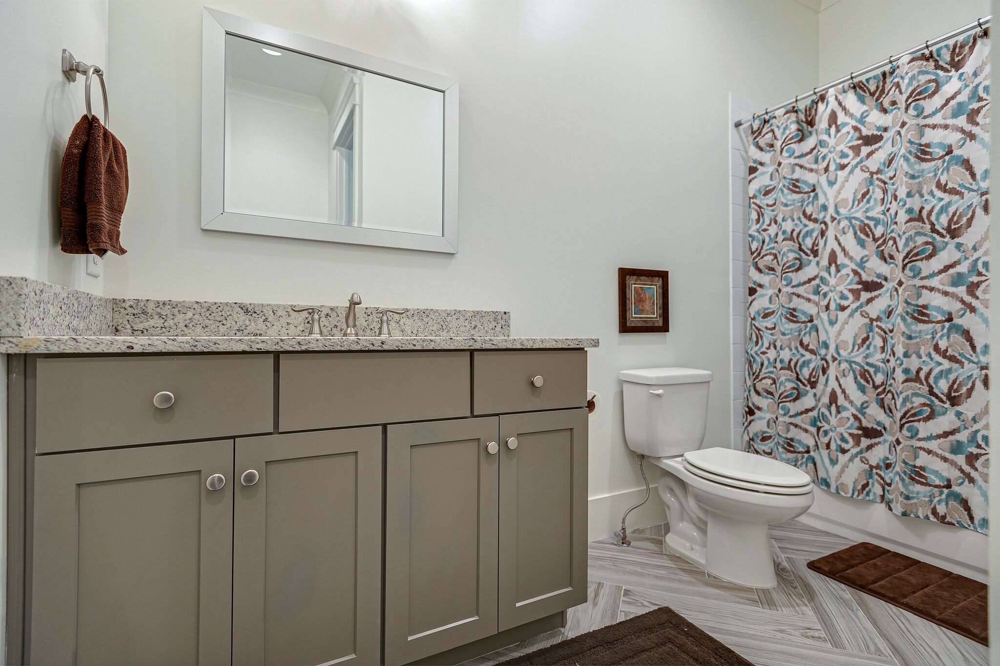 8448 Heirloom Boulevard College Grove, TN 37046 - Photo 34 of 41 a bathroom with a granite countertop toilet sink and mirror