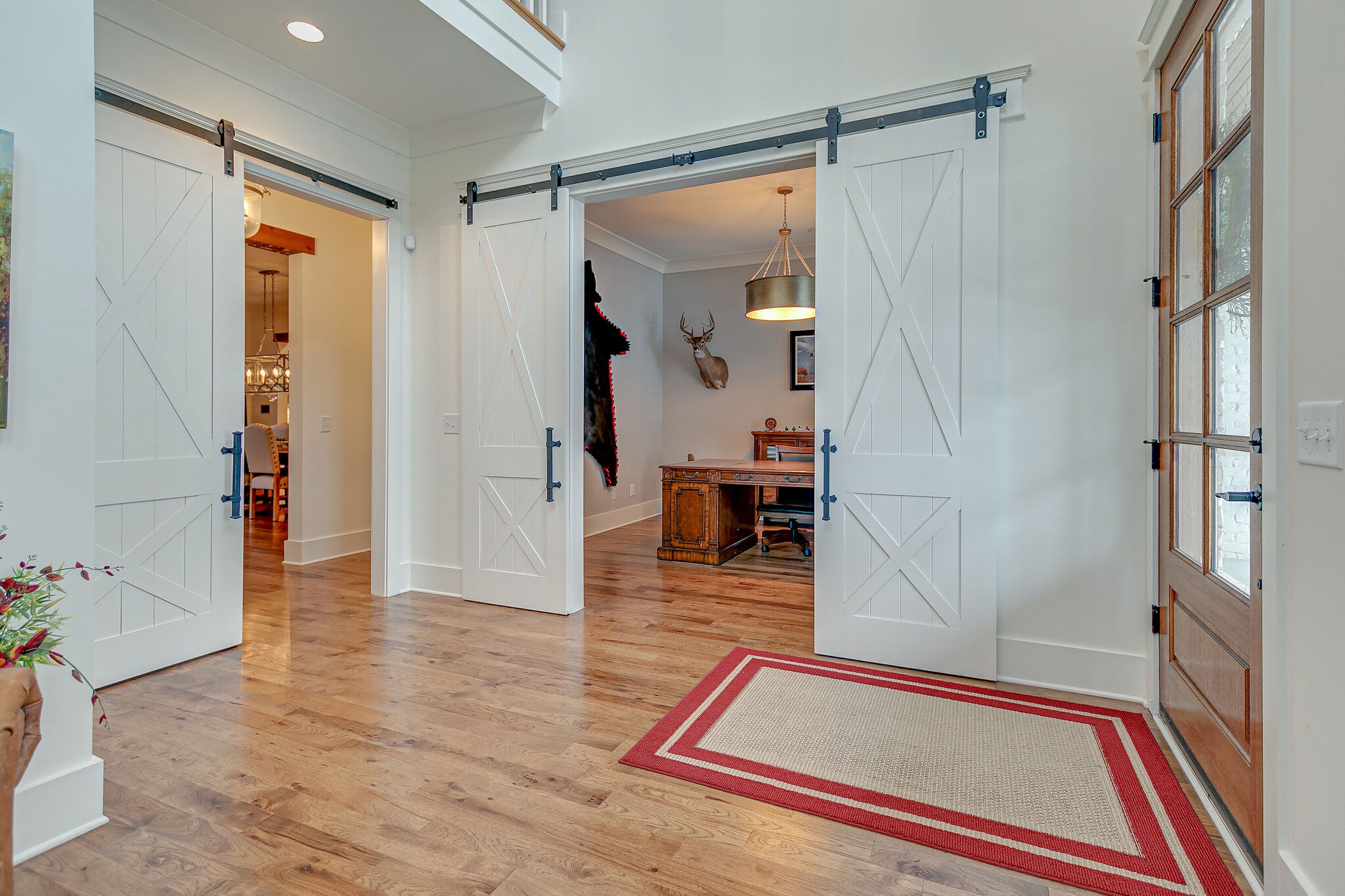 8448 Heirloom Boulevard College Grove, TN 37046 - Photo 7 of 41 a room with wooden floor and a glass door shower