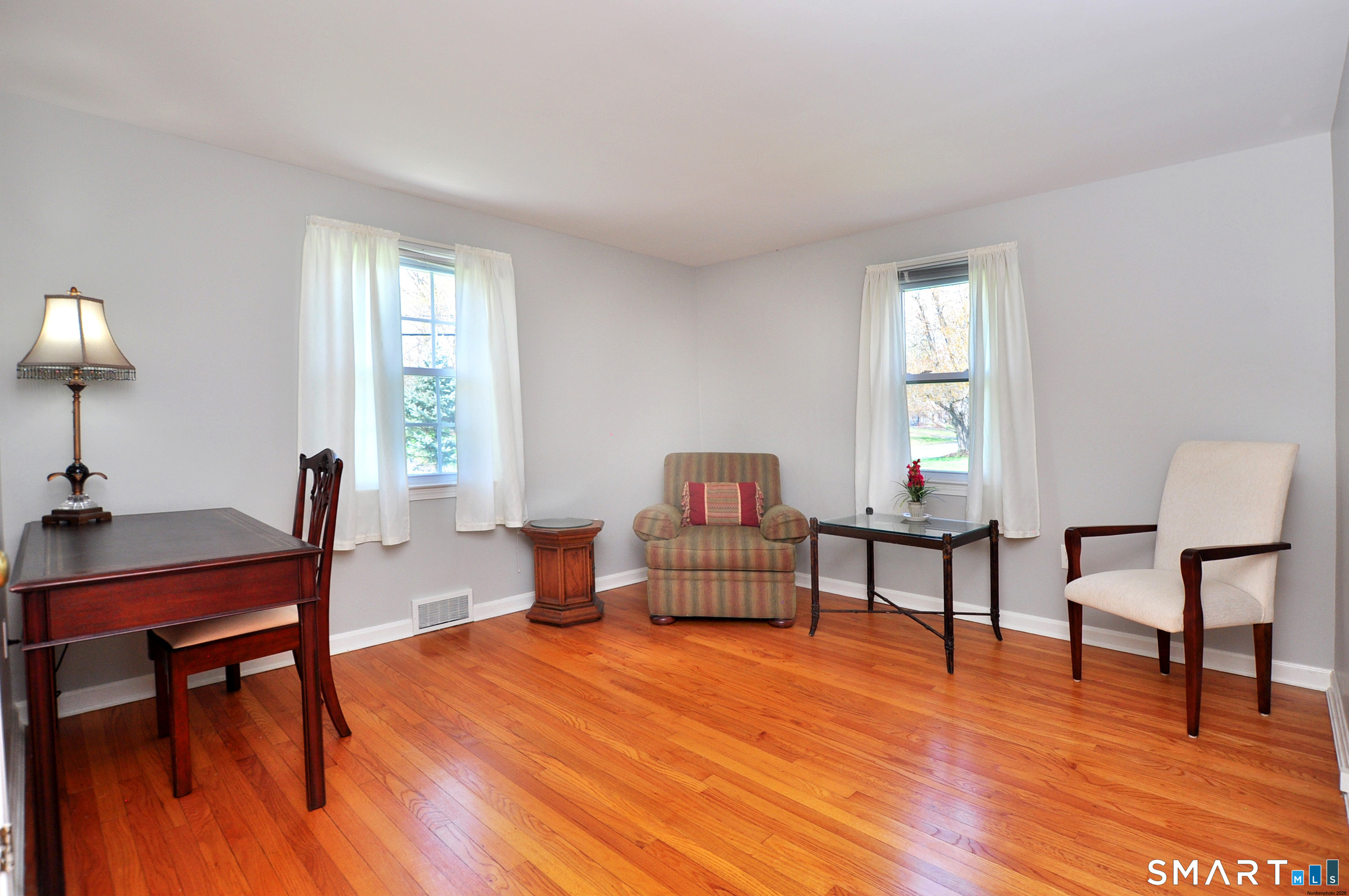 36 Pilgrim Drive Windsor, CT 06095 - Photo 20 of 33 a living room with furniture and a wooden floor
