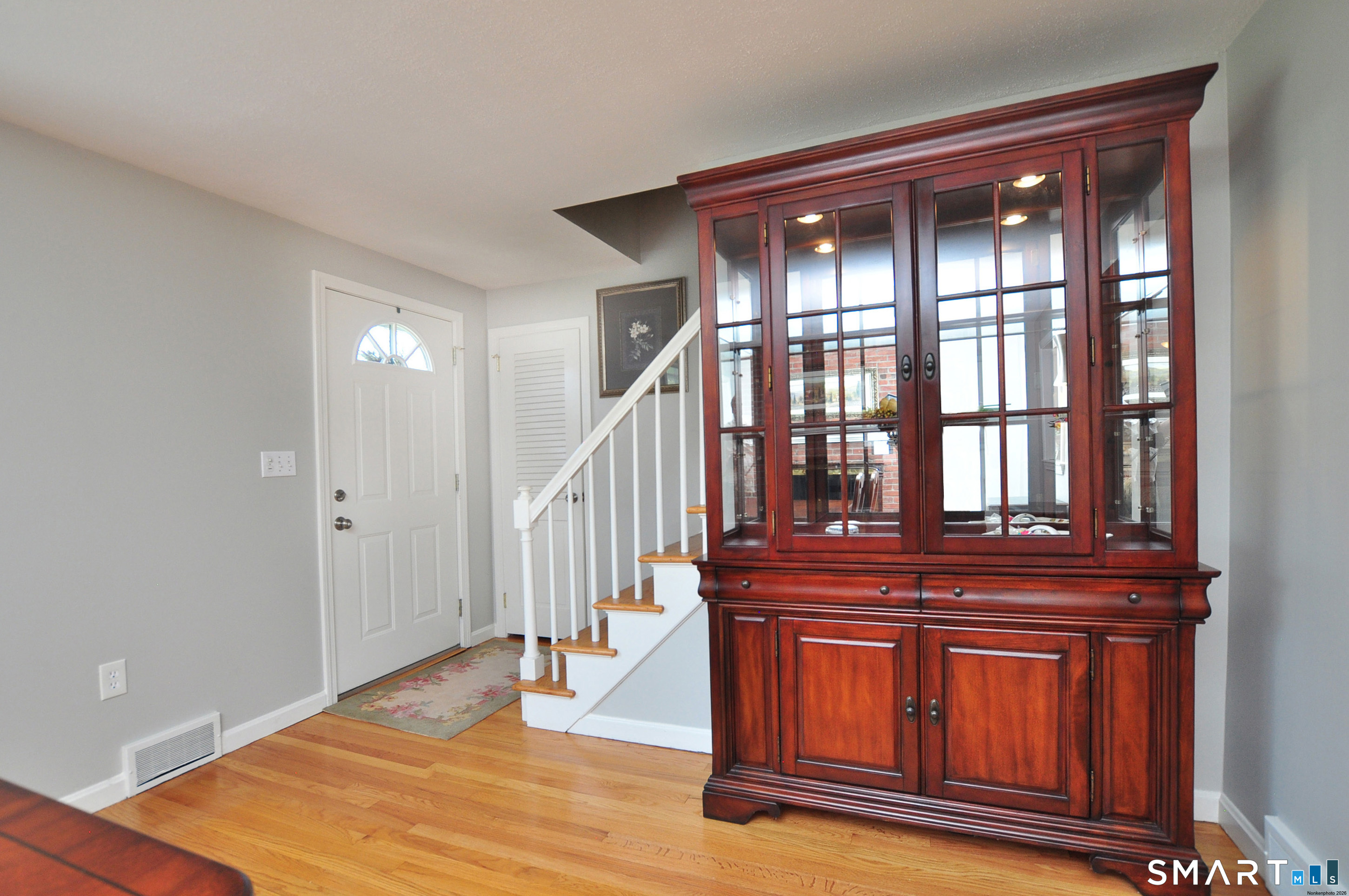36 Pilgrim Drive Windsor, CT 06095 - Photo 23 of 33 a view of front door with hallway and wooden floor
