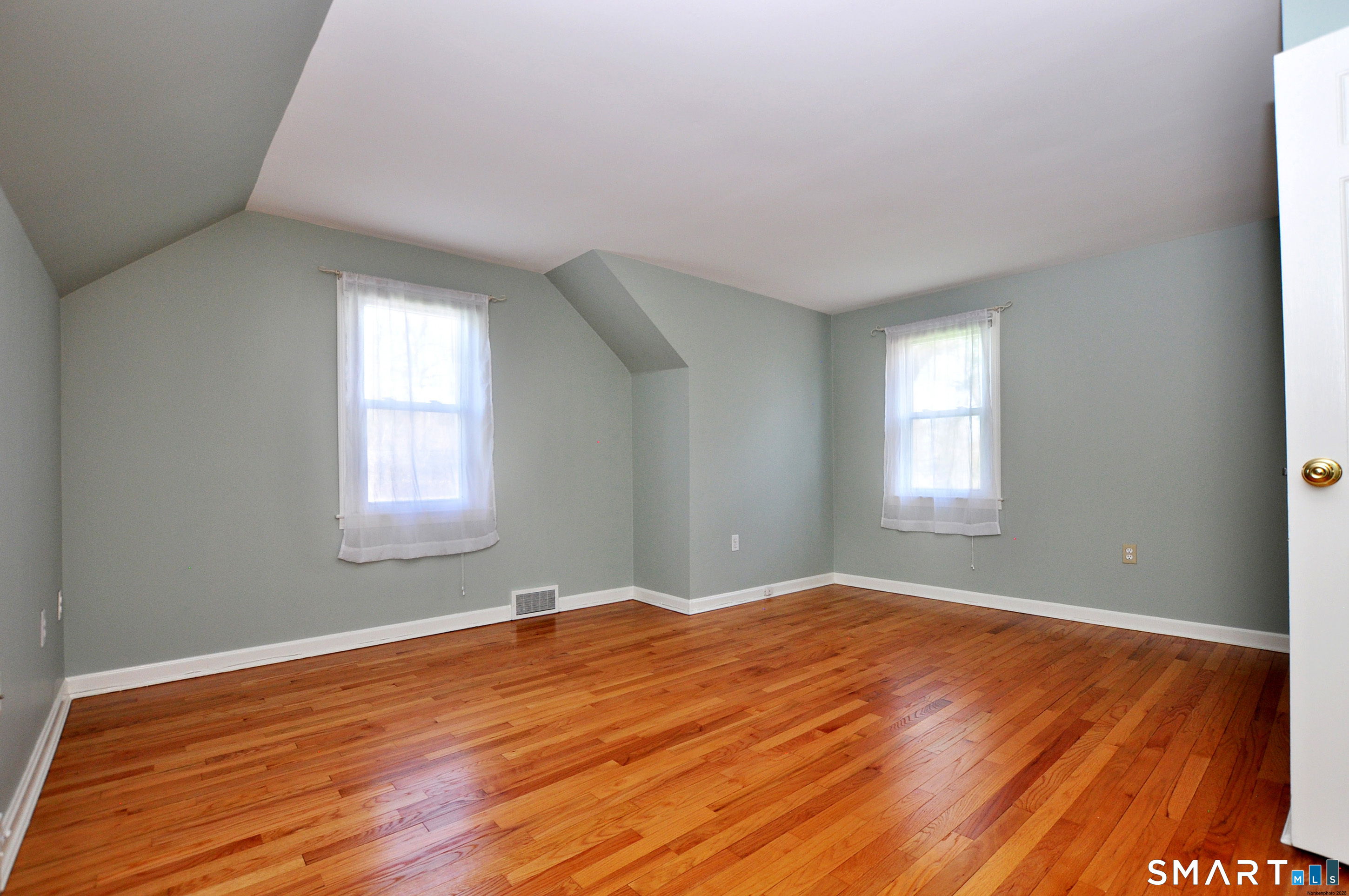 36 Pilgrim Drive Windsor, CT 06095 - Photo 27 of 33 a view of empty room with wooden floor and fan