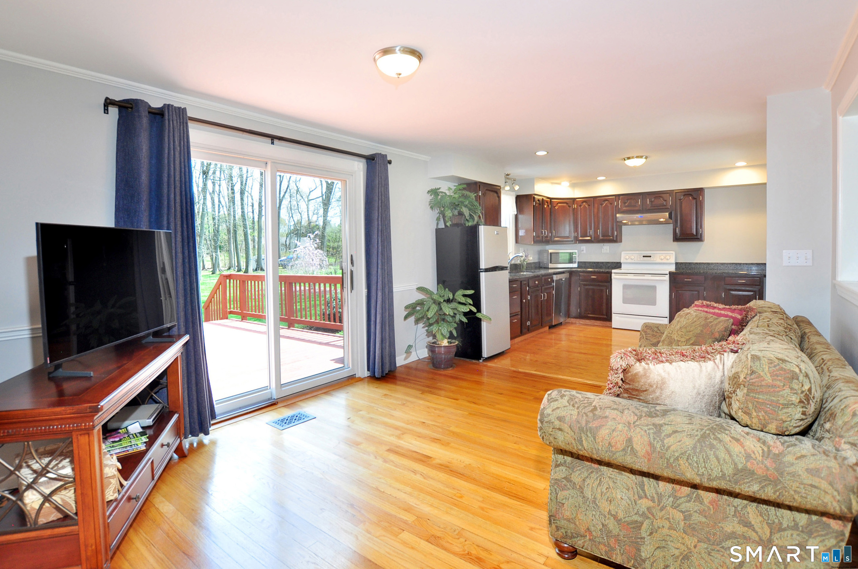 36 Pilgrim Drive Windsor, CT 06095 - Photo 10 of 33 a bed room with a flat screen tv and a refrigerator