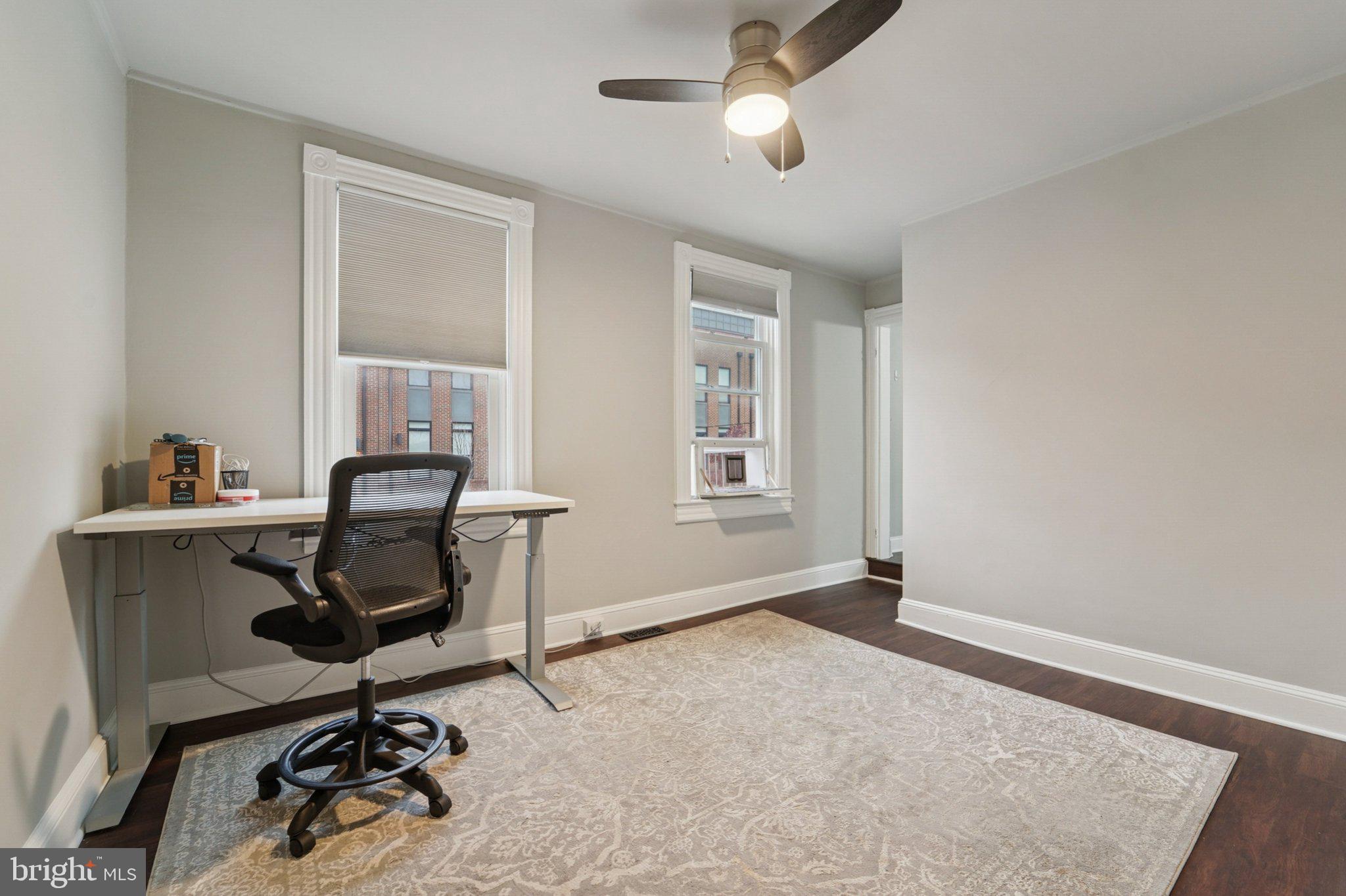 3929 Hudson Street Baltimore, MD 21224 - Photo 17 of 48 a view of a workspace with furniture and a window