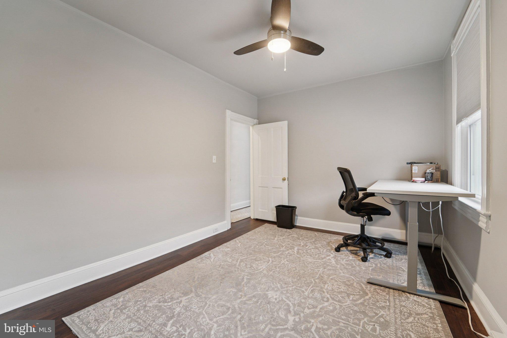 3929 Hudson Street Baltimore, MD 21224 - Photo 18 of 48 a view of a workspace with furniture and a window