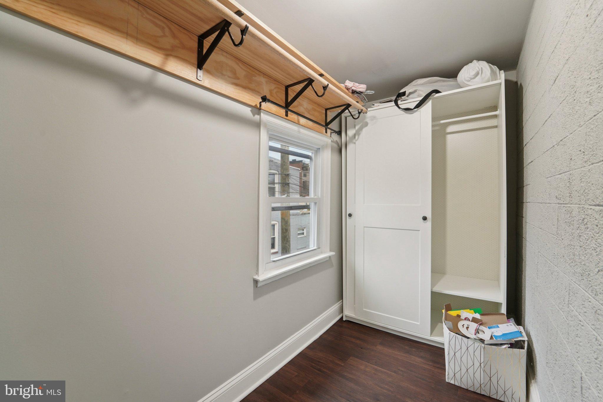 3929 Hudson Street Baltimore, MD 21224 - Photo 19 of 48 a view of walk in closet with clothes and shoes