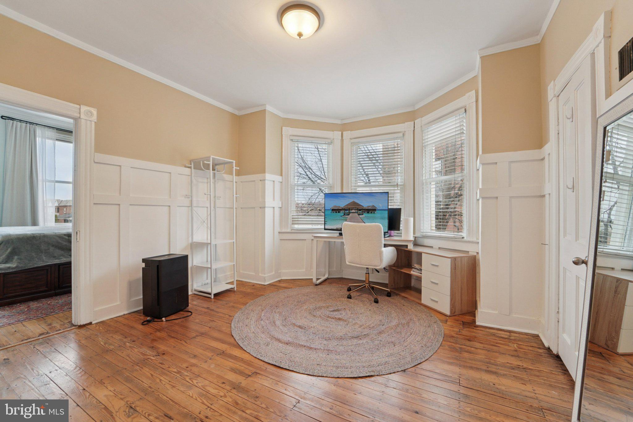 3929 Hudson Street Baltimore, MD 21224 - Photo 21 of 48 a living room with furniture and a wooden floor