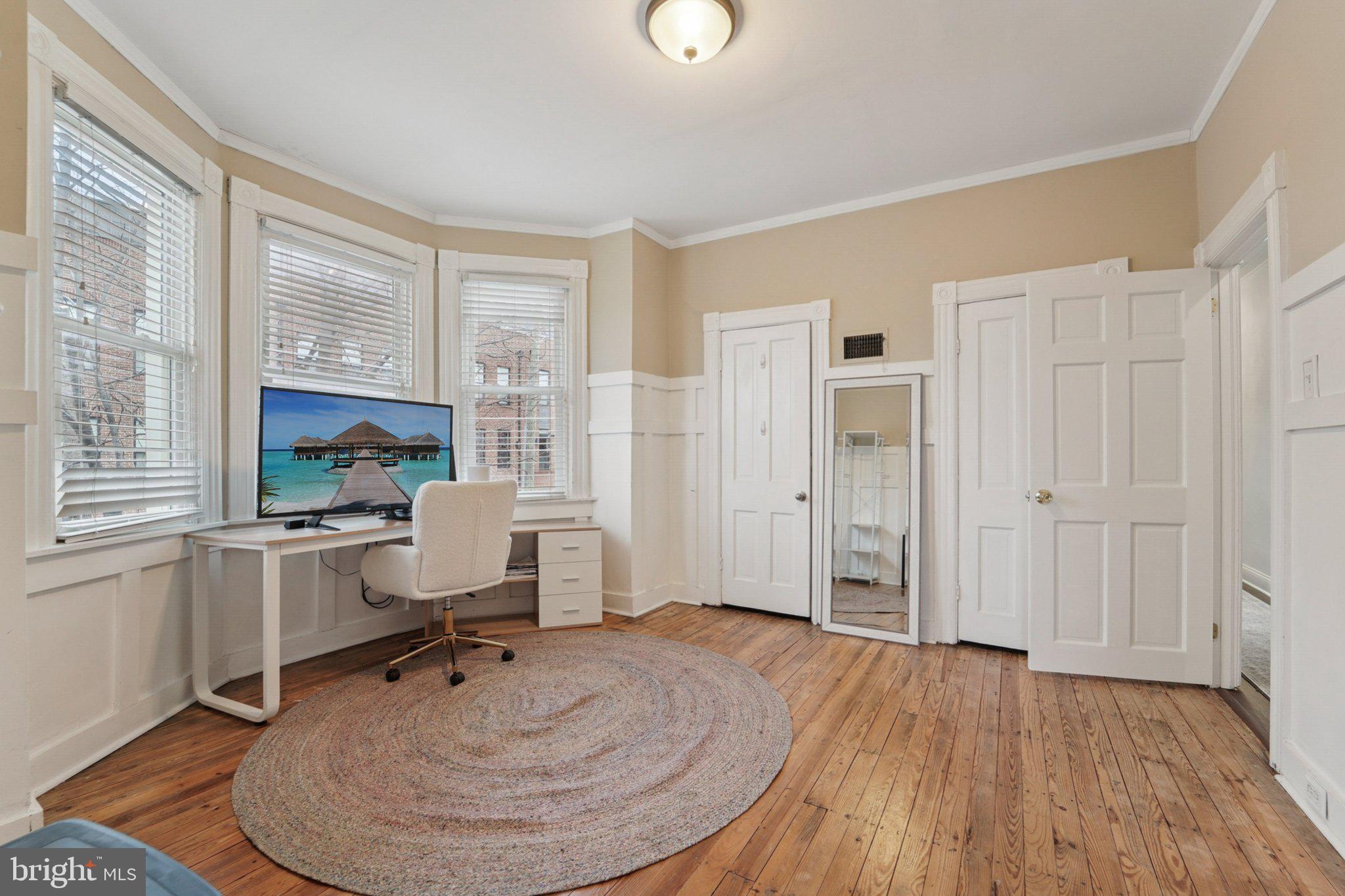 3929 Hudson Street Baltimore, MD 21224 - Photo 22 of 48 wooden floor and windows in a room with a window